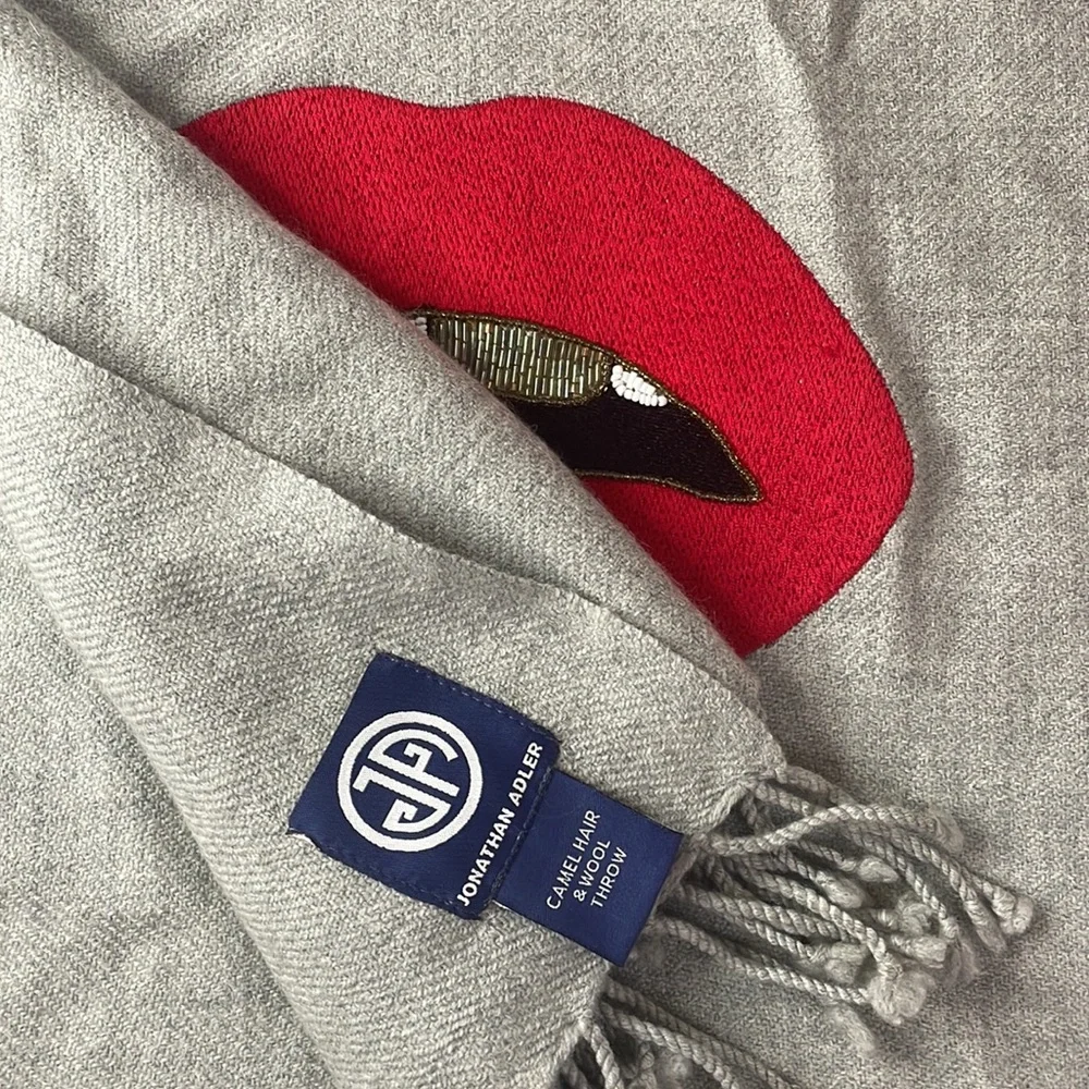 Lip embellished throw